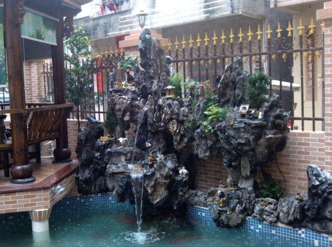 华通园林假山 现代园林中真石头假山的艺术特点